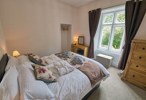 1 bedroom with King sized bed on first floor. Garden view