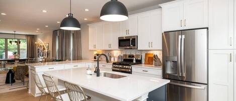 Open Kitchen with counter seating - modern appliances & amenities throughout!