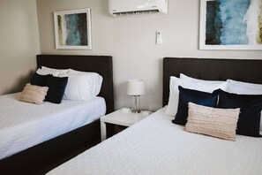 Second bedroom includes 2 queen beds (both highly rated 12" memory foam mattresses) and an attached full bathroom
