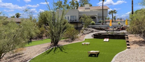 Back yard where you can play cornhole, badminton, spike ball, etc.