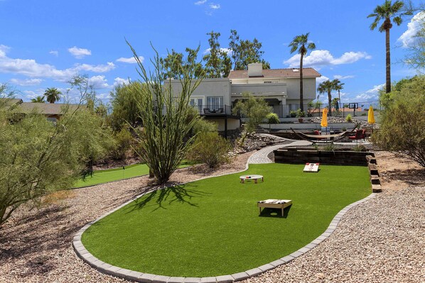 Back yard where you can play cornhole, badminton, spike ball, etc.