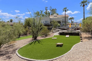 Back yard where you can play cornhole, badminton, spike ball, etc.