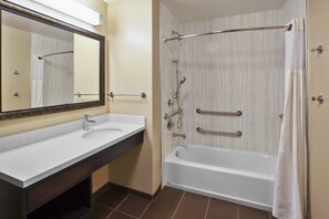 Get ready for your day in the bathroom that features an accessible tub.
