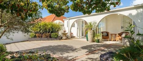 Beautiful sun filled private courtyard with indoor/outdoor flow