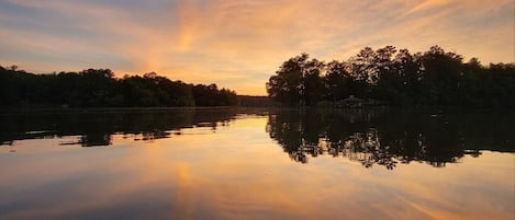 Sunset view from the boat in our cove