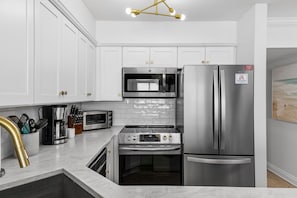 Updated stainless appliances: microwave, range, fridge, toaster oven, and more