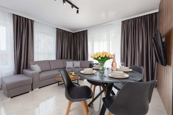 Living room with a comfortable sofa and TV. 