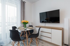Large table with chairs for eating communal meals. 