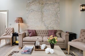 Williamston Cowshed - sitting room with feature wall