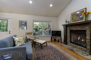 Cozy up around the fireplace in the living room to stream your favorite shows & movies on the Smart TV!