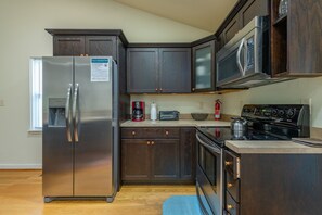 Kitchen complete with dishwasher & standard drip coffeemaker.