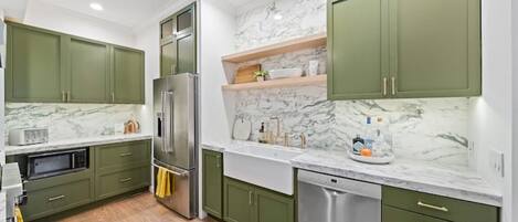 Modern kitchen, marble counters, farmhouse sink