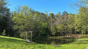 Swing as the sun sets & watch your friends or family fish in your private pond. 