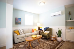 Spacious living room with a sofa-bed that comfortably sleeps two people.