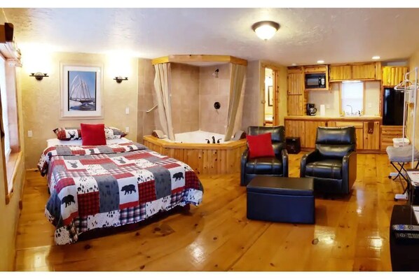 Romantic cabin with a Jacuzzi tub in the room also features kitchenette