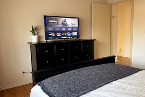 Bedroom #1 - 8 drawer dresser and 42" Roku TV. Spacious closet on the right.