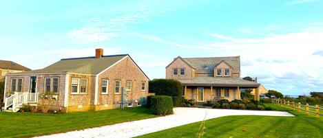 Cottage on left; bunk house in middle/background; main house on right