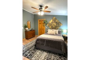 Master bed room with dresser, closet, and bathroom. A perfect cozy space.