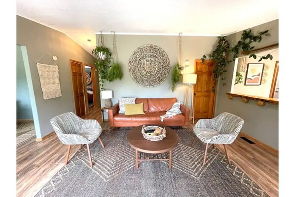 Our living space is super cozy & bright with windows overlooking the State Park!