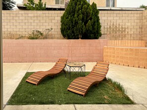 Peaceful backyard with wooden outdoor furniture