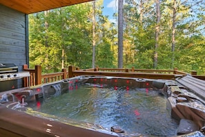 Immerse yourself in nature’s embrace with a soothing soak in the hot tub, where the whispers of the forest blend with the bubbles of relaxation.