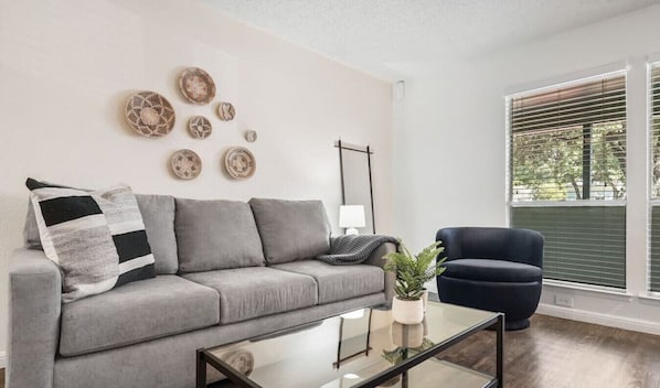 Living room with smart TV and plenty of seating