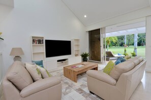 Equipped with Netflix, stream your favourite shows from the living room TV and kick back between dual sofas 