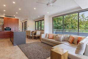 Open plan living is great for entertaining, with ceiling fans and A/C to keep temperatures comfortable. 
