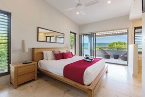 The primary bedroom on the third floor offers a comfortable king bed with air-conditioning.
