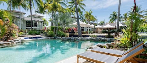 Immerse yourself in the Far North Queensland tropical vibes while lounging by the resort's pool.