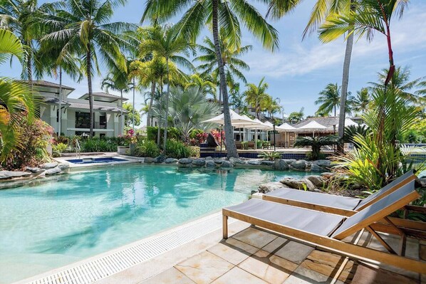 Immerse yourself in the Far North Queensland tropical vibes while lounging by the resort's pool.