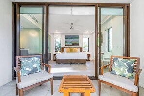 Awaken in serenity within the expansive primary king-sized bedroom, complete with a private hot tub and a tranquil balcony for your exclusive relaxation.
