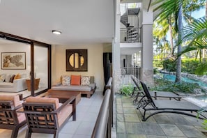 Step onto your private undercover patio and take in the captivating views of the lagoon pool, creating a serene oasis just steps away.
