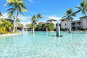 Dive into tropical vibes and endless relaxation by the sprawling pools, surrounded by lush greenery.
