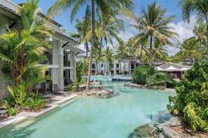 Immerse yourself in tropical vibes by the lagoon pool.