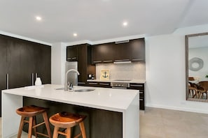 Prepare delicious meals in the fully-equipped kitchen and enjoy a morning cuppa at the breakfast bar.