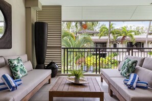 The living room extends to a private undercover balcony where you can kick back and enjoy the tropical breeze.