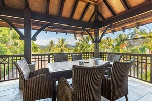 Stay comfortable dining alfresco in the undercover deck with a six-seater table overlooking the tree tops