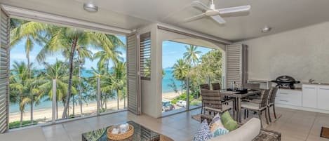 Enjoy uninterrupted ocean views between swaying palms from your private balcony. 