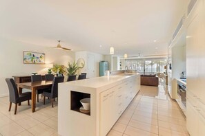 Chefs will love using the spacious kitchen equipped with modern appliances to whip up a feast