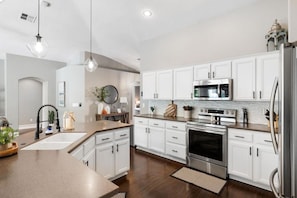 Large, open kitchen provides space for many cooks!