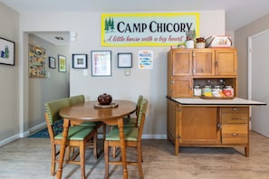 The dining room and kitchen welcome you as you enter -- it's one of our favorite places to hang out, cook, and eat!