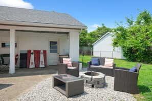 Fenced-in back yard with privacy, outdoor seating and fire pit!