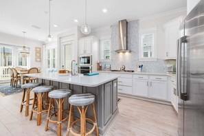The gourmet kitchen features seating for 4 at the island - perfect for a quick bite or a kids table!