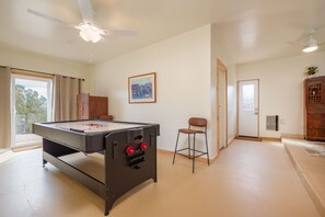 The Game room, a flexible space that opens to the driveway and side yard.