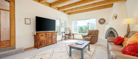 Traditional Southwestern living room with native wood vigas and decorative Kiva.