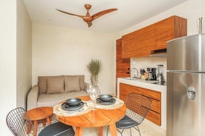 Cute cozy kitchen area w/ sitting room sofa.