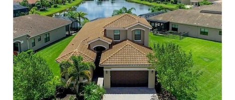 Aerial view of home on lake