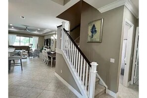 Entrance hall with stairs to fourth bedroom and bath