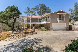 Spacious 2-Story 3 bedroom, 2.5 bath, plus small gameroom/lounge on almost two acres of property surrounded by oak trees, boulders and views of the sierras!